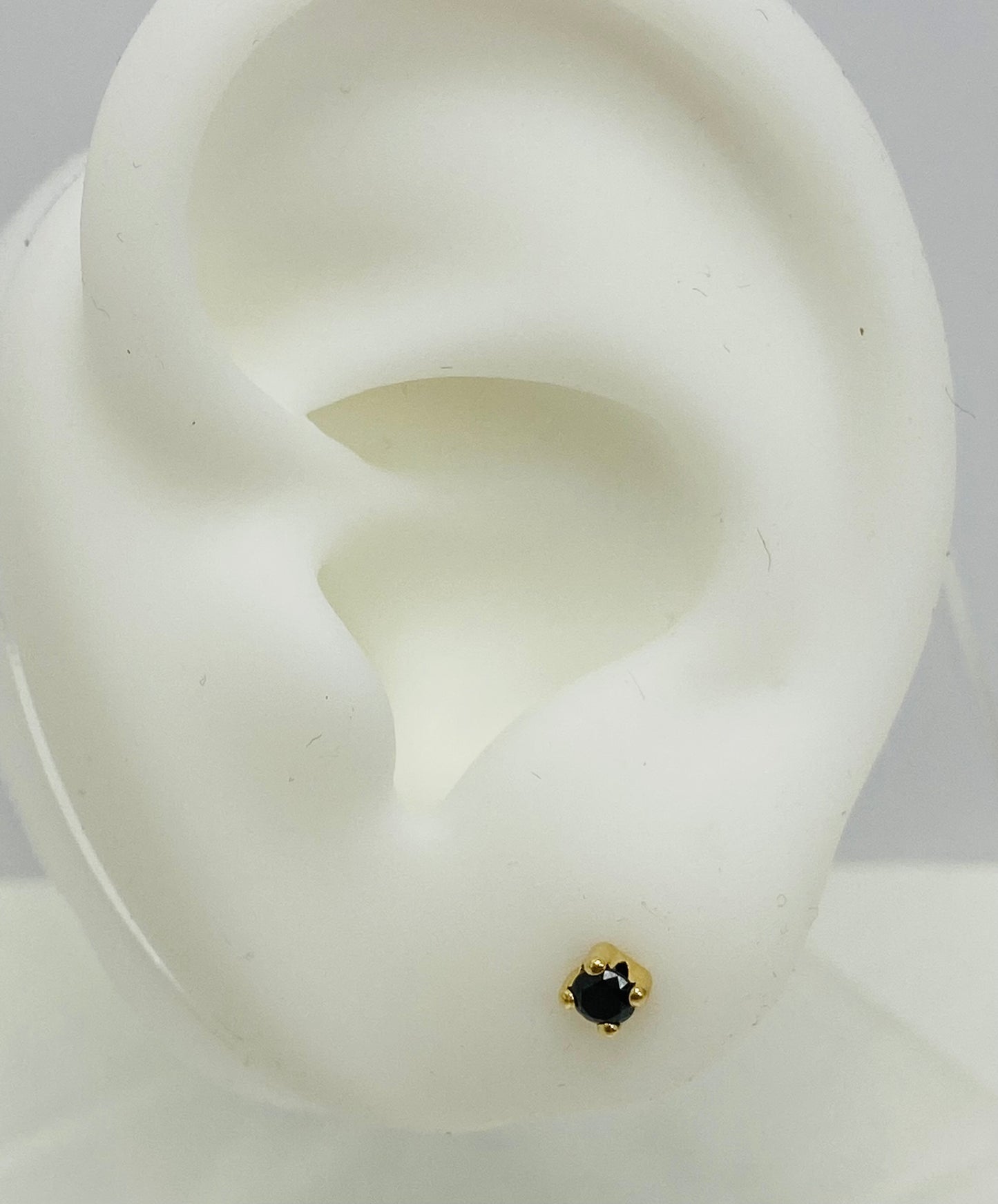 Aretes de bebé piedra oscura 14k