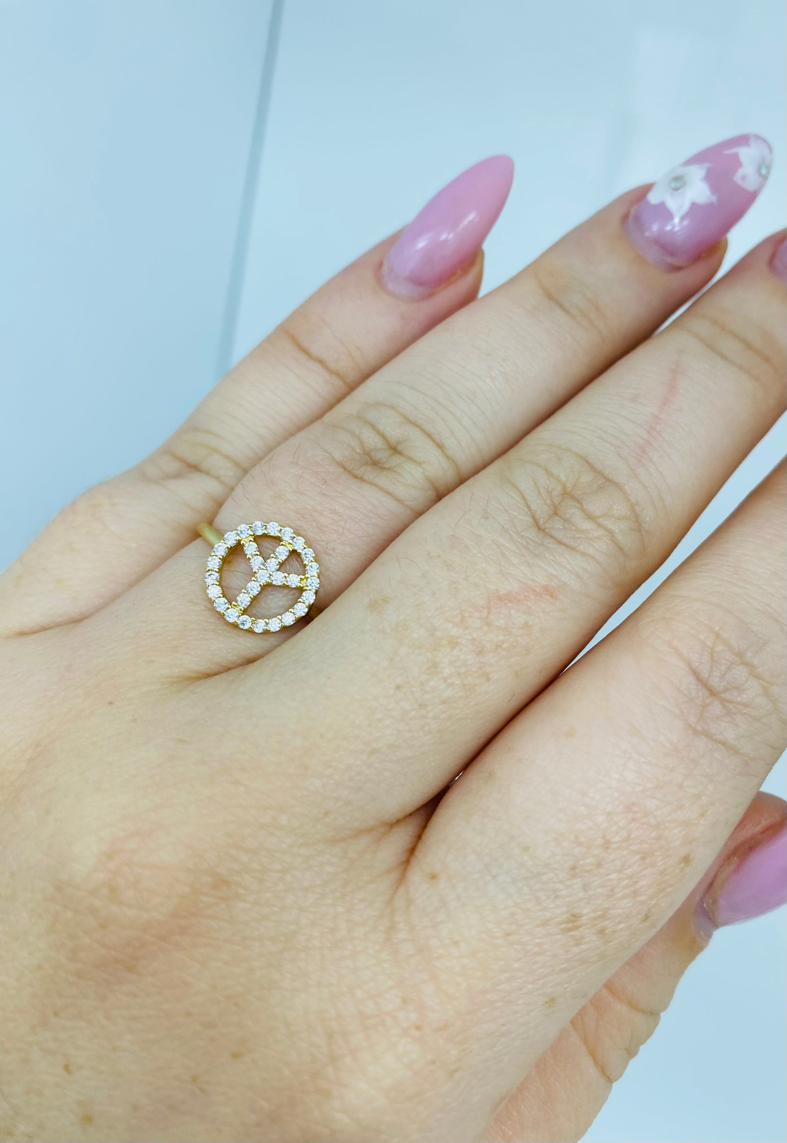 Anillo símbolo de la paz sirconia 14k