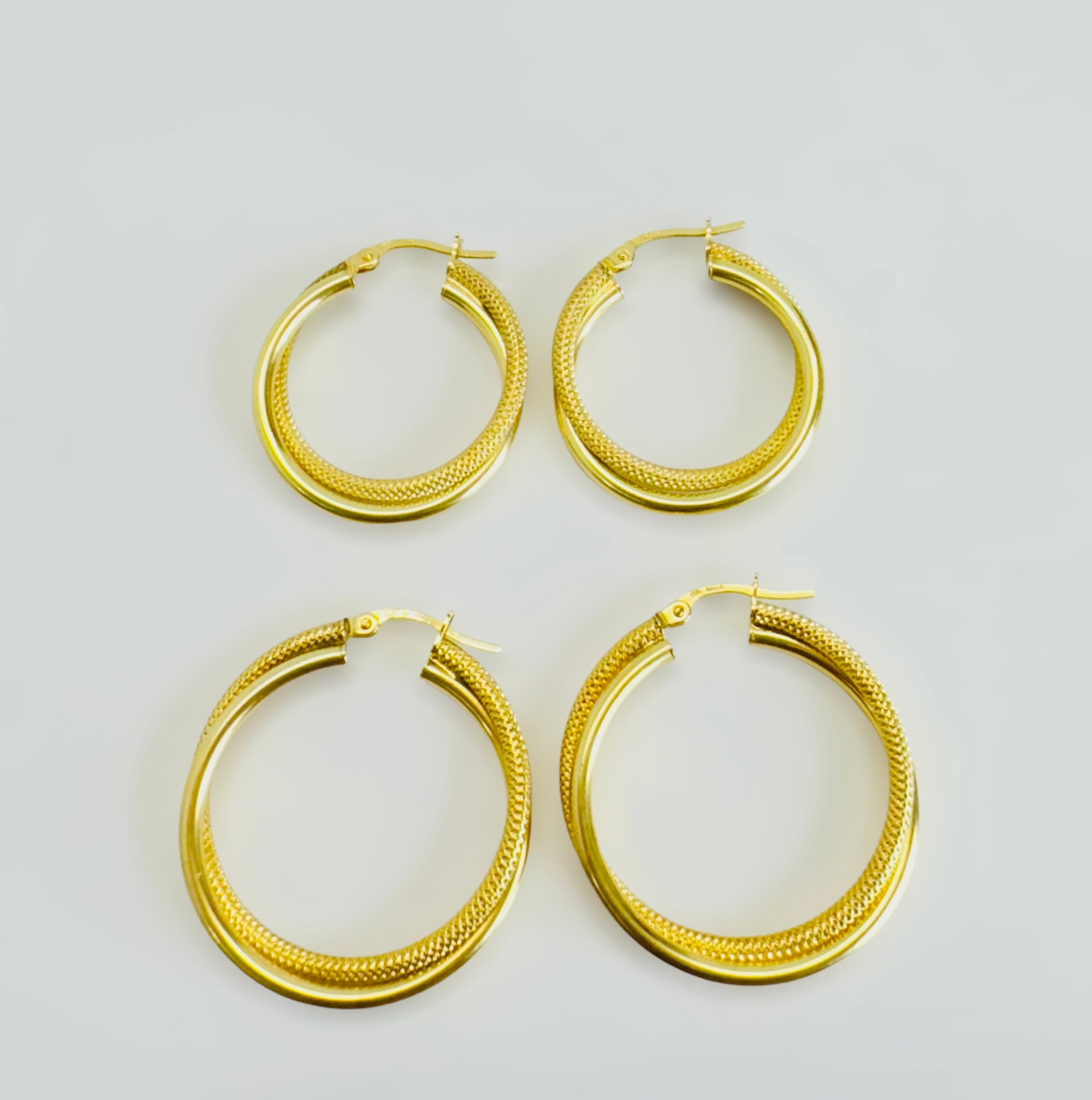 Argollas torcidas combinadas 14k