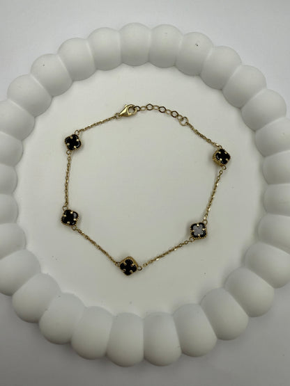 Pulsera de flores negra y dorada 10K