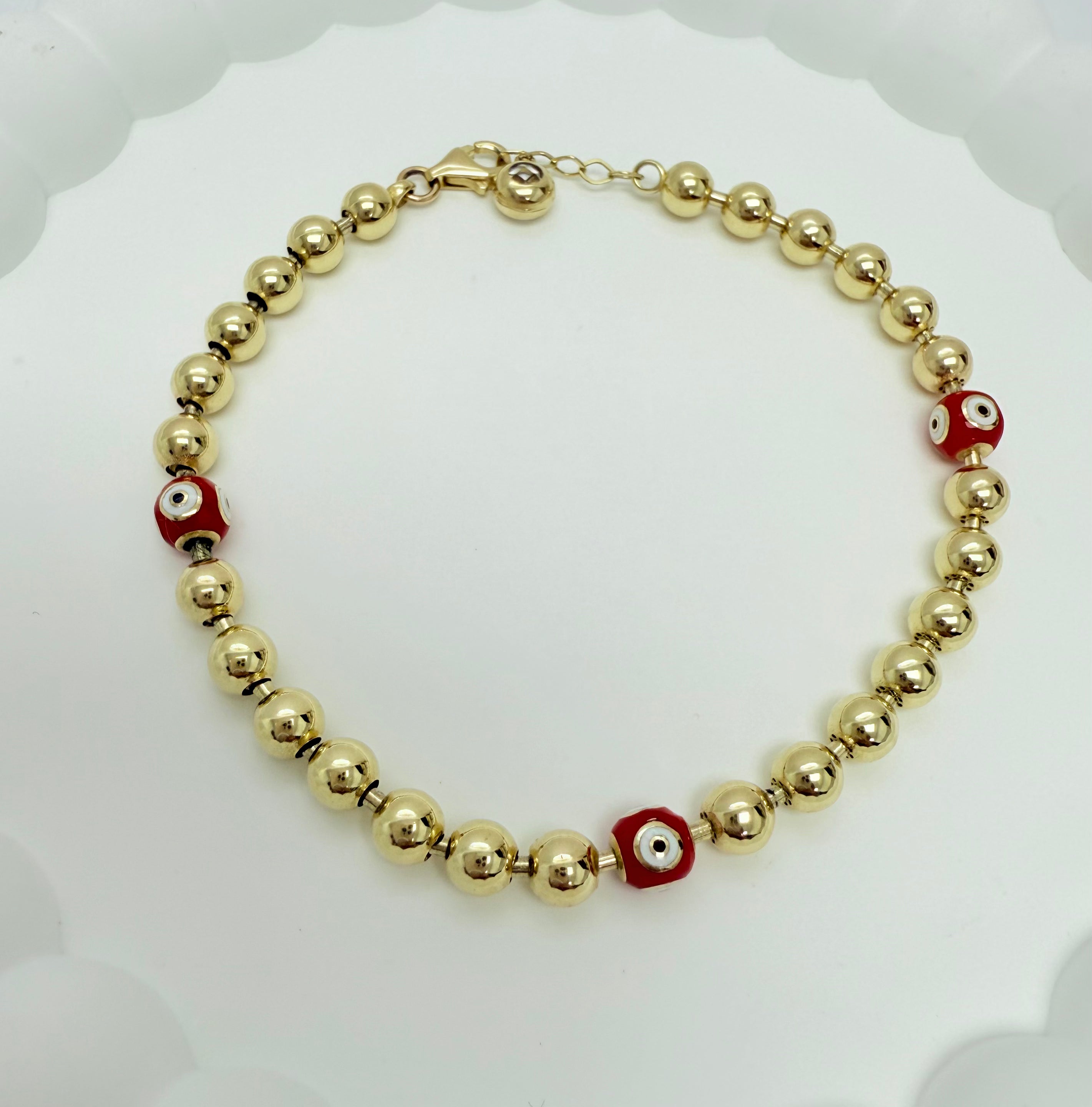 Pulsera de bolas y ojos turcos 10k